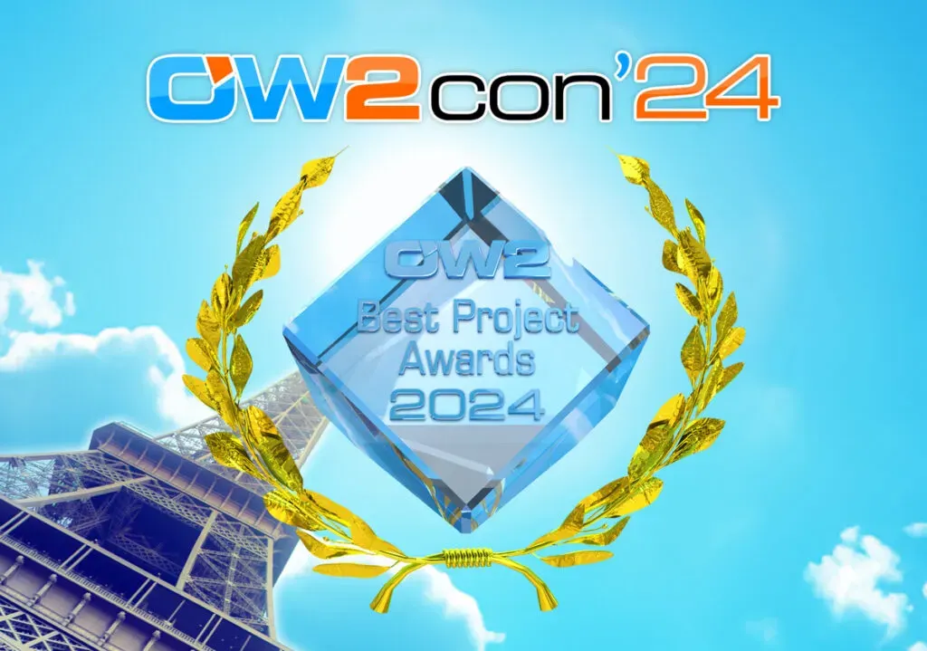 Trophée OW2 Best Project Awards 2024 remis lors de l'OW2con'24, un cristal entouré de lauriers dorés devant la tour Eiffel